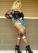 Mature blonde in ripped pantyhose